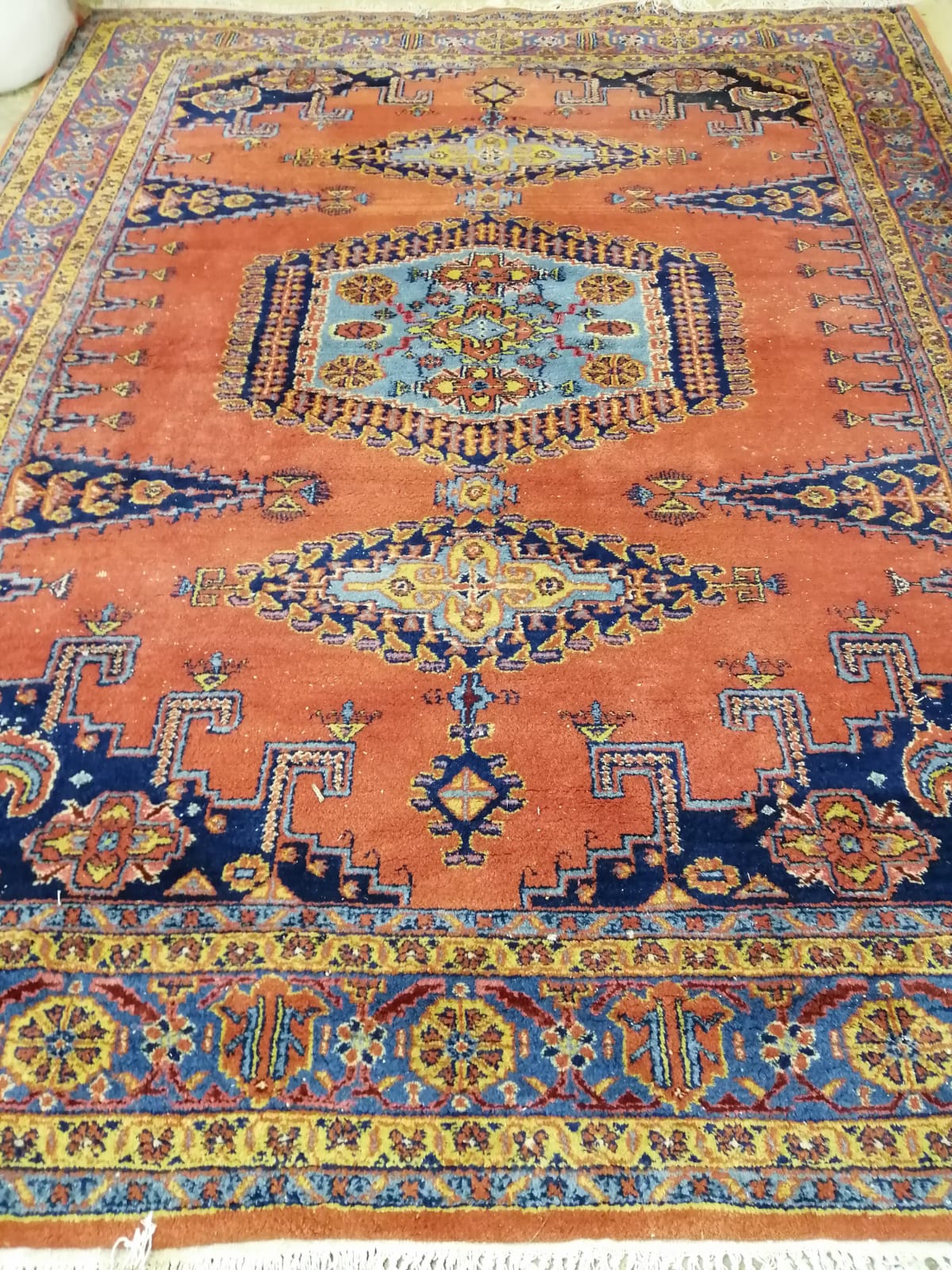 A Turkish red ground carpet, 337cm x 249cm